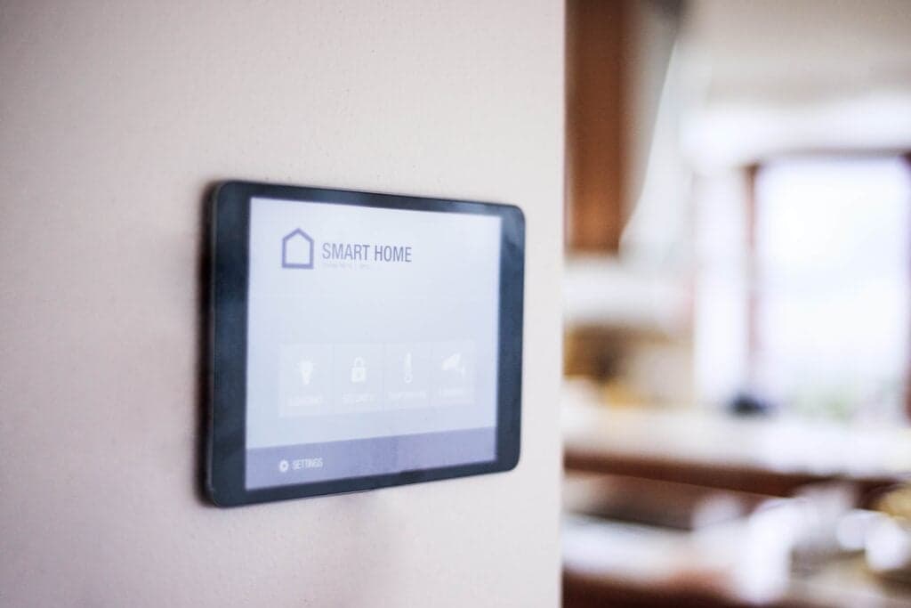 Smart home electrical setup in Clermont FL 2 A digital tablet mounted on a white wall displaying a